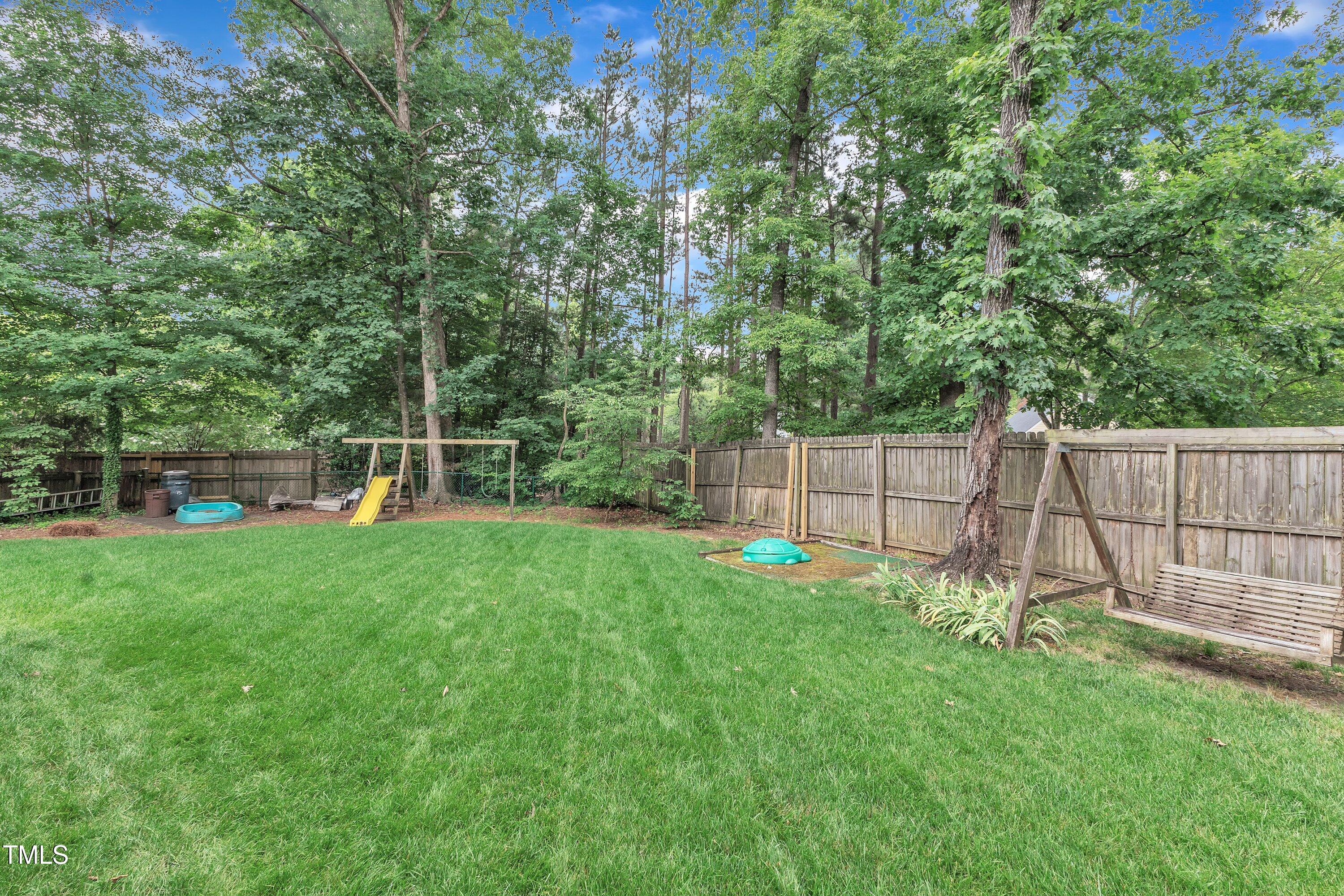 7613 Percy Court Raleigh, NC 27613 - Photo 48 of 51 a view of a backyard with a small garden