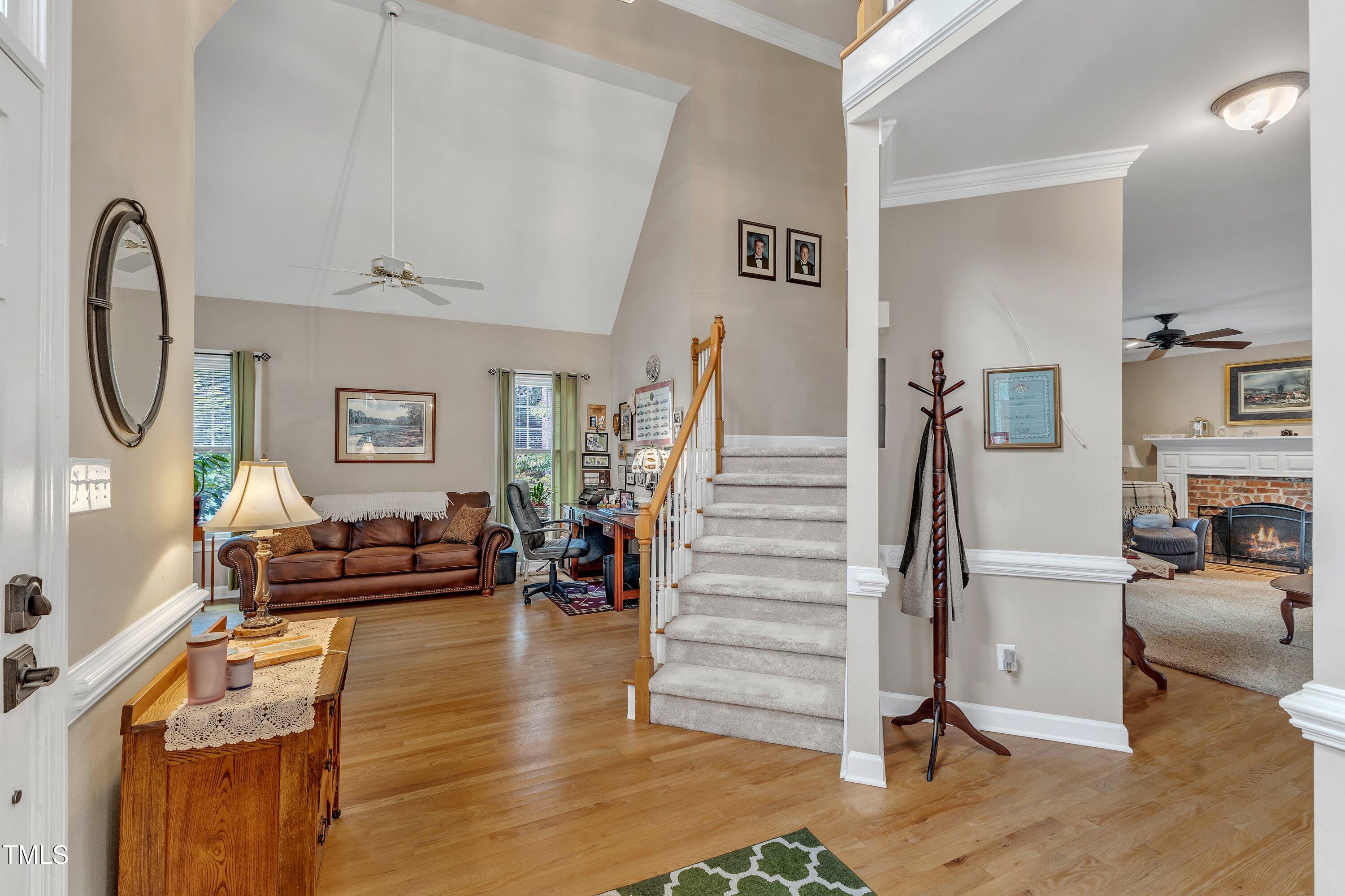 7613 Percy Court Raleigh, NC 27613 - Photo 5 of 51 a living room with furniture and a fireplace