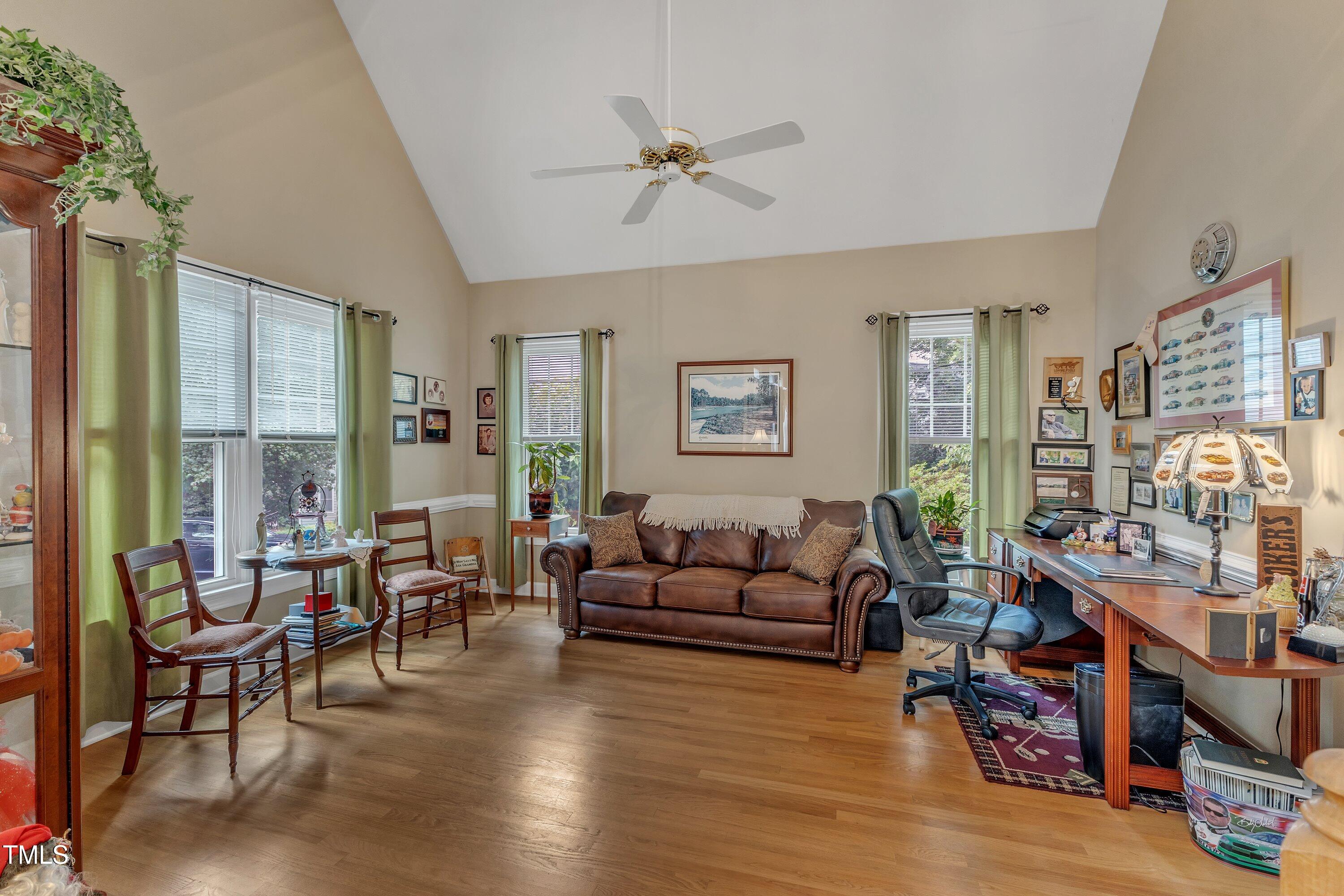 7613 Percy Court Raleigh, NC 27613 - Photo 6 of 51 a living room with furniture and a large window