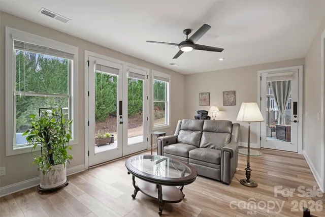 a living room with furniture and a large window