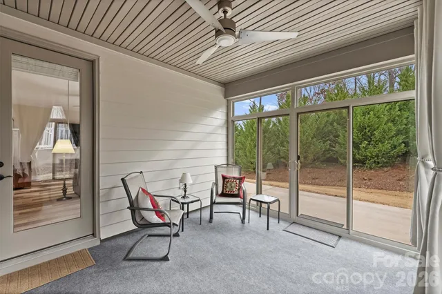 a view of a two chairs in the balcony