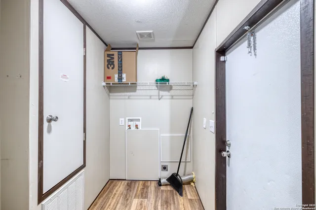 a view of kitchen with furniture and wooden floor