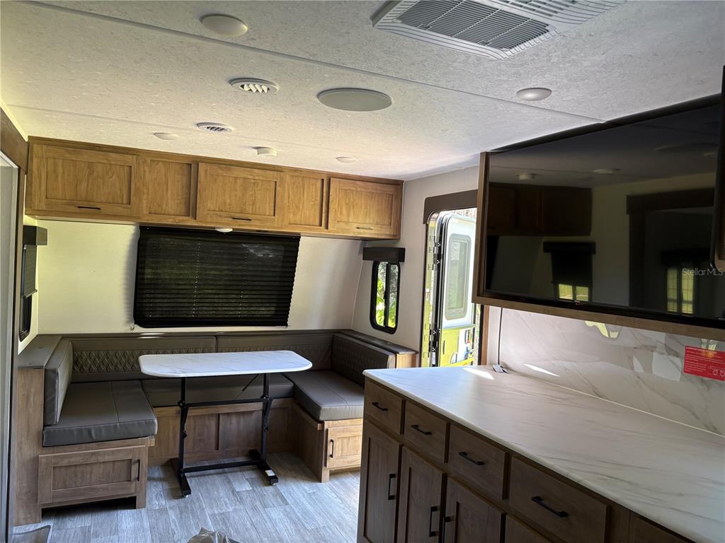 1575 Northeast 100th Street Anthony, FL 32617 - Photo 21 of 29 a hallway with furniture and a wooden floor