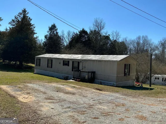 a house with trees in the background