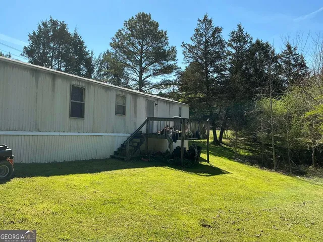 a view of a backyard with a patio