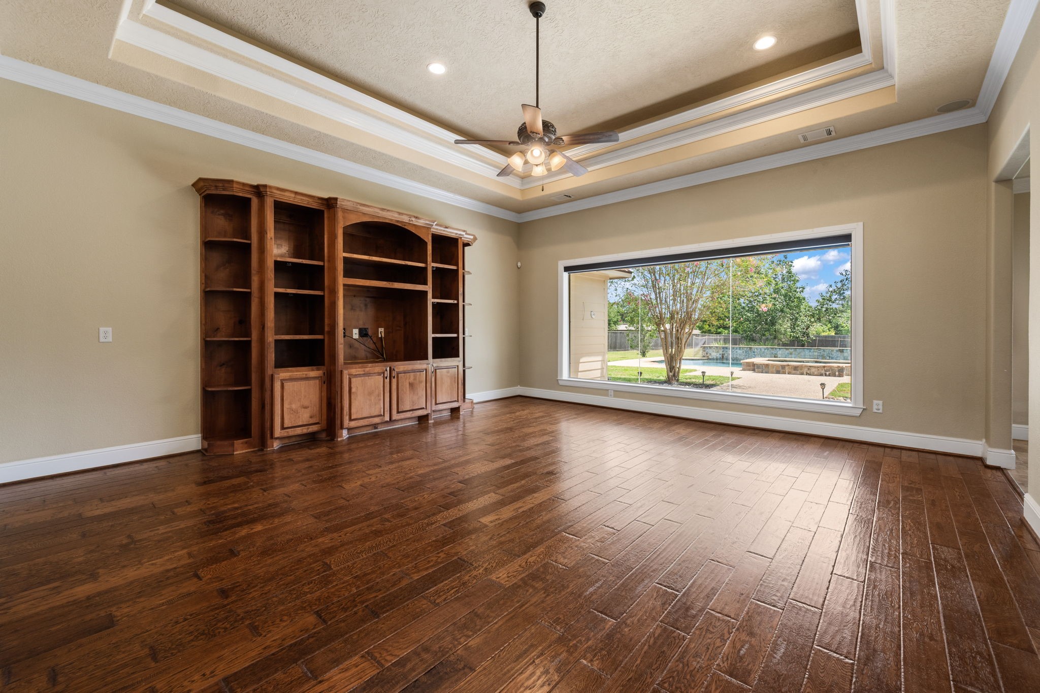 5041 Rimrock Pass Montgomery, TX 77316 - Photo 8 of 44 Large open den with built in TV/bookcase with a breathtaking view into the backyard/pool area