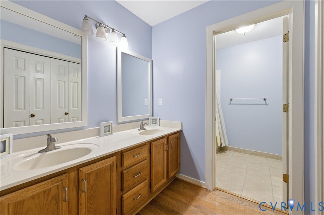 4099 Doe Run Road Hopewell, VA 23860 - Photo 17 of 36 Bathroom featuring a double vanity with wood-finis