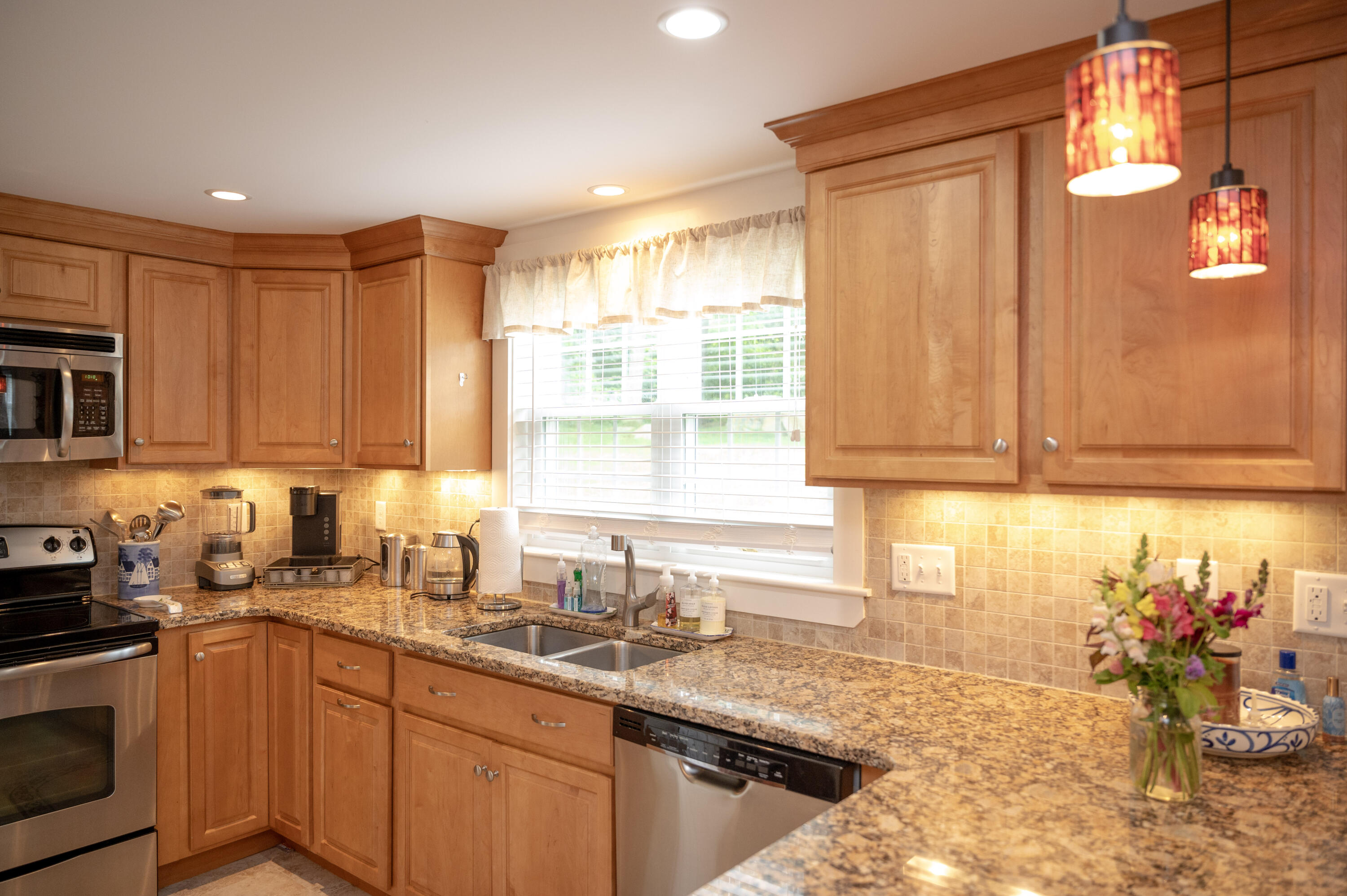 46 Bournedale Road Buzzards Bay, MA 02532 - Photo 19 of 46 a kitchen with stainless steel appliances granite countertop a sink stove and cabinets