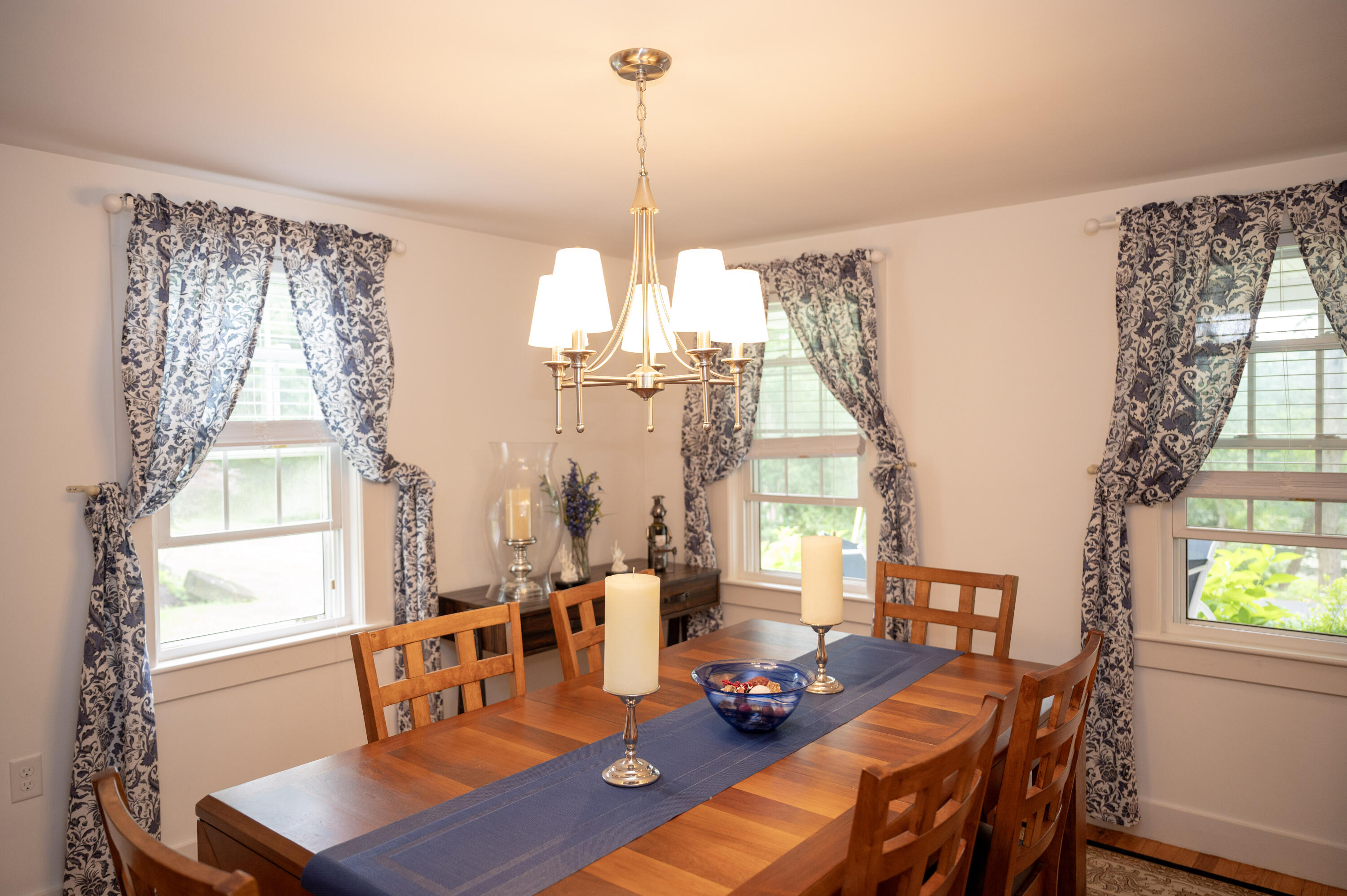 46 Bournedale Road Buzzards Bay, MA 02532 - Photo 22 of 46 a view of a dining room with furniture a chandelier and wooden floor