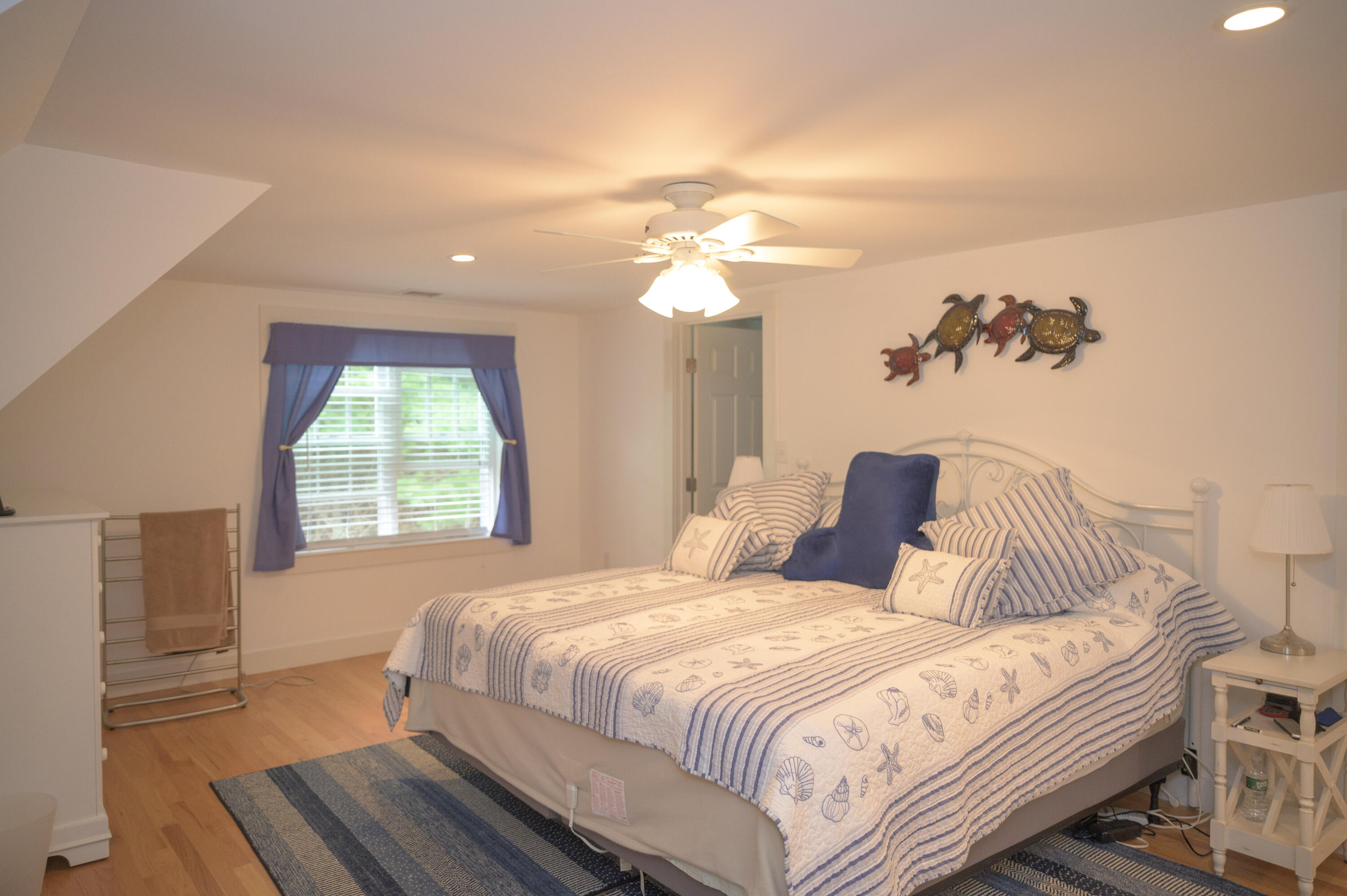 46 Bournedale Road Buzzards Bay, MA 02532 - Photo 24 of 46 a bedroom with a bed and a chandelier