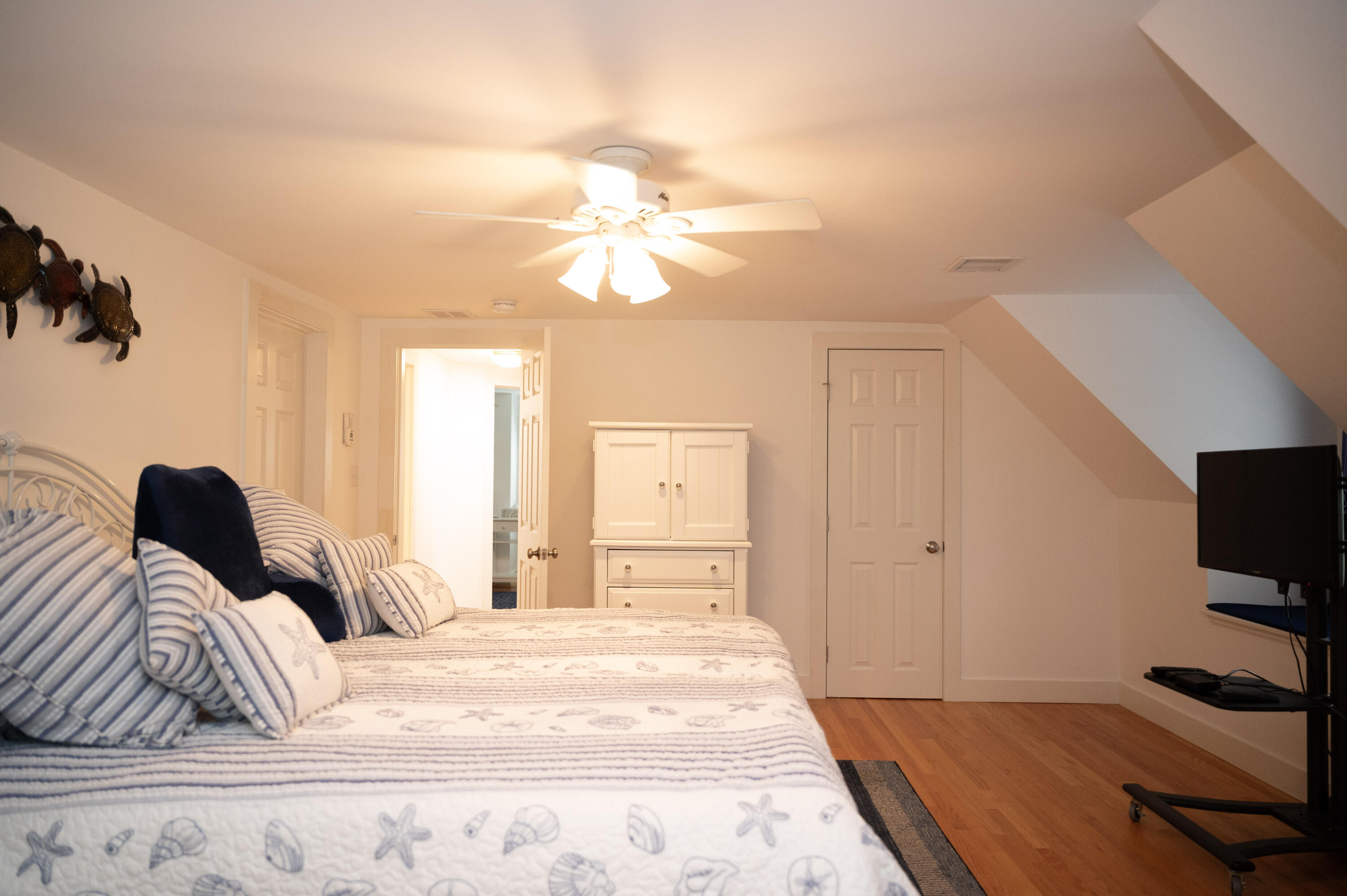 46 Bournedale Road Buzzards Bay, MA 02532 - Photo 25 of 46 a bedroom with a bed and a flat tv screen on the dresser