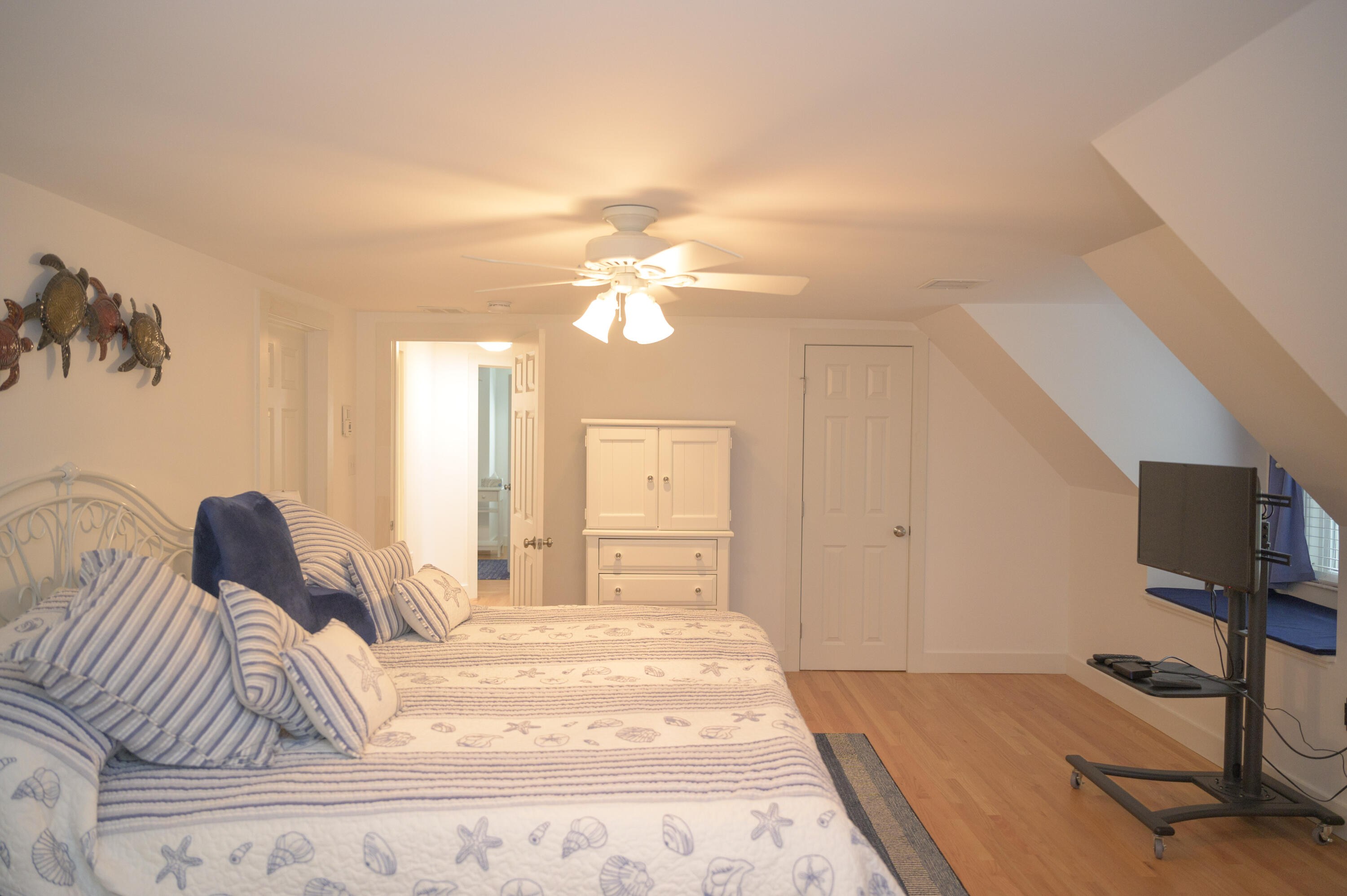 46 Bournedale Road Buzzards Bay, MA 02532 - Photo 26 of 46 a bedroom with a bed and a chandelier