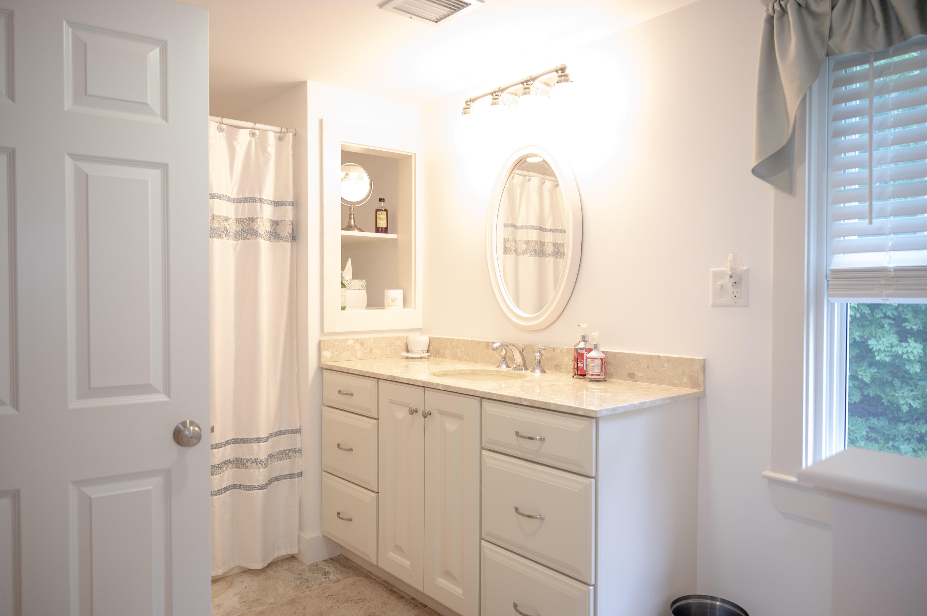 46 Bournedale Road Buzzards Bay, MA 02532 - Photo 27 of 46 a en suite bathroom with a double vanity sink a mirror and a shower