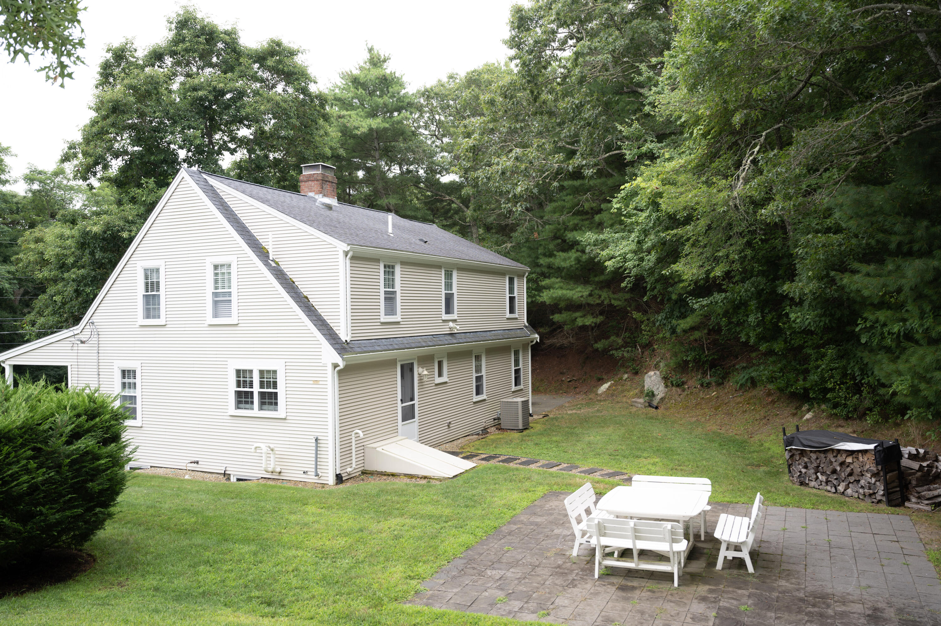 46 Bournedale Road Buzzards Bay, MA 02532 - Photo 38 of 46 a view of a house with a backyard and a patio