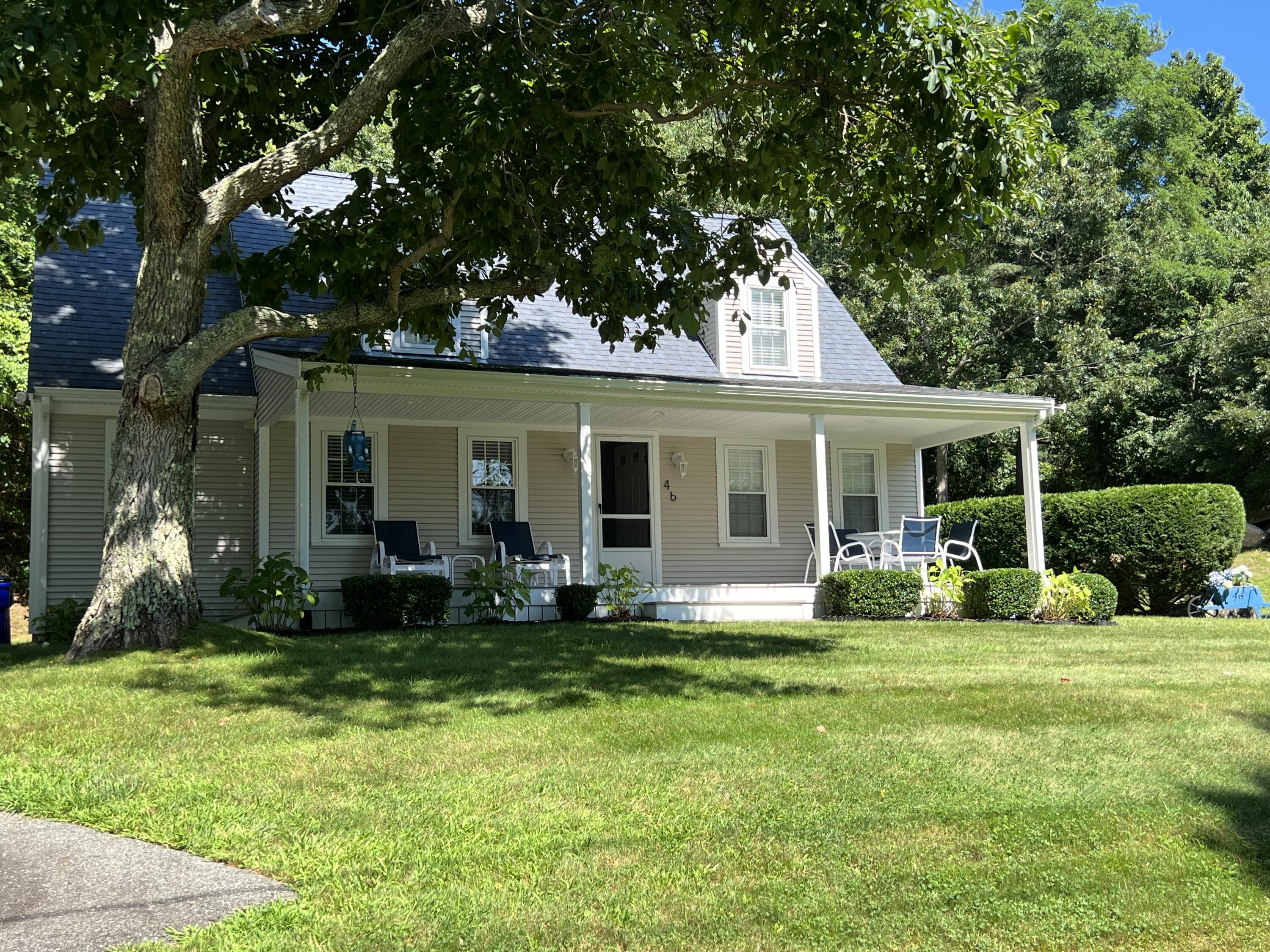 46 Bournedale Road Buzzards Bay, MA 02532 - Photo 5 of 46 a front view of a house with a yard and porch