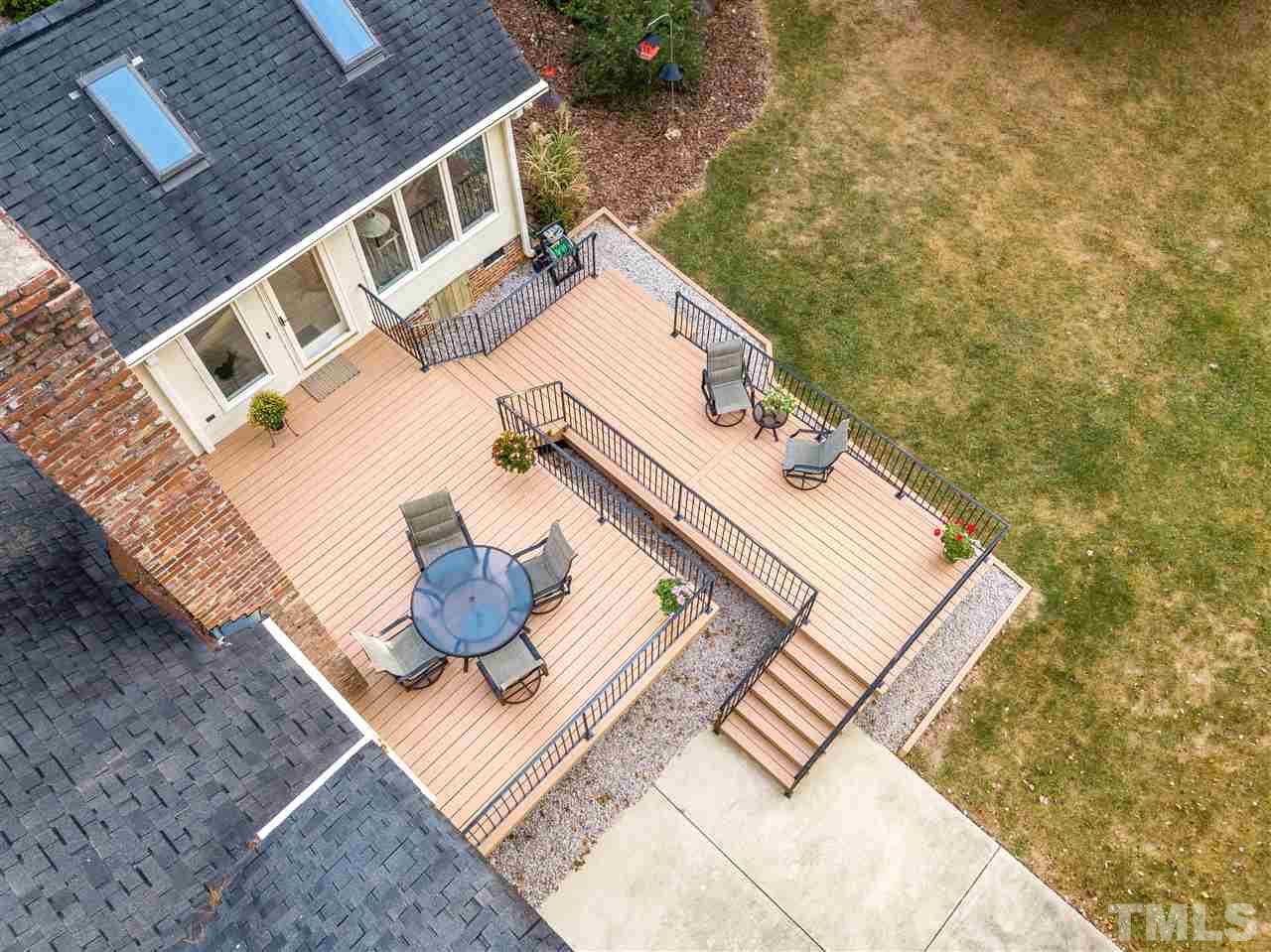 805 Brookfield Road Raleigh, NC 27615 - Photo 3 of 27 a roof deck with couch and wooden floor