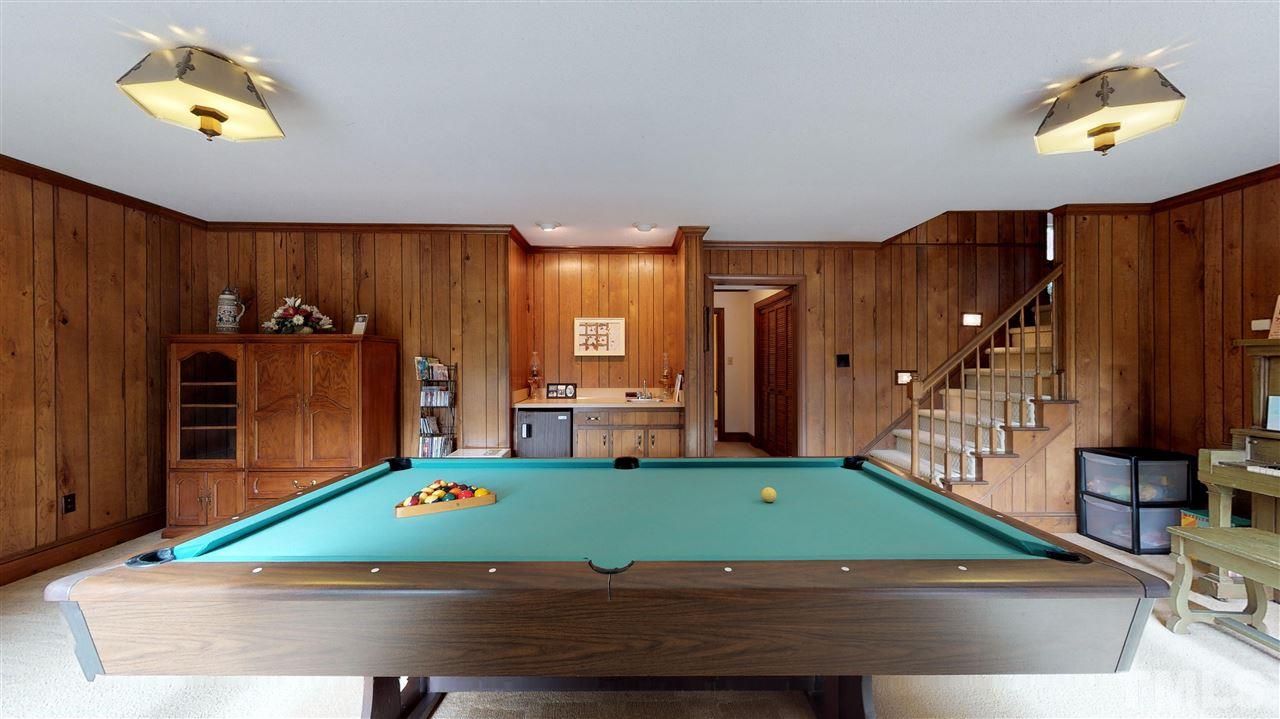 805 Brookfield Road Raleigh, NC 27615 - Photo 22 of 27 a room with pool table and windows