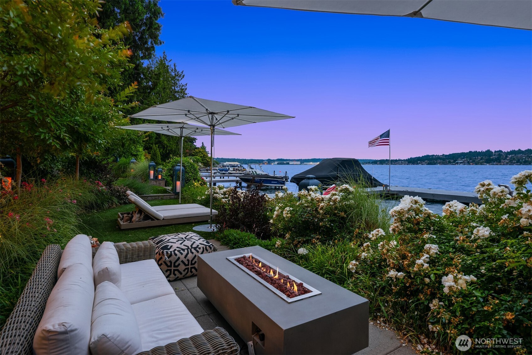 8097 West Mercer Way Mercer Island, WA 98040 - Photo 31 of 40 an outdoor sitting area with furniture and umbrella