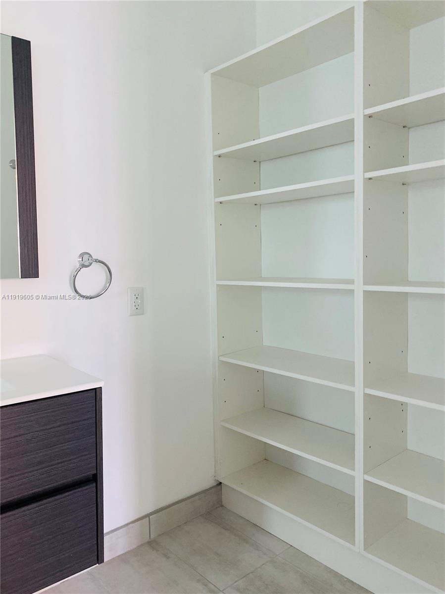 1201 Pennsylvania Avenue, Unit 206 Miami Beach, FL 33139 - Photo 2 of 9 a view of an empty walk in closet