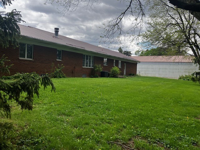 4015 East 1st Road Mendota, IL 61342 - Photo 3 of 45 a backyard of a house with plants and large tree