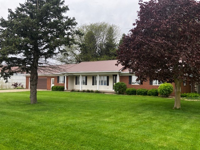 4015 East 1st Road Mendota, IL 61342 - Photo 33 of 45 a front view of a house with a garden