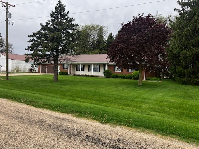 4015 East 1st Road Mendota, IL 61342 - Photo 35 of 45 a front view of a house with garden
