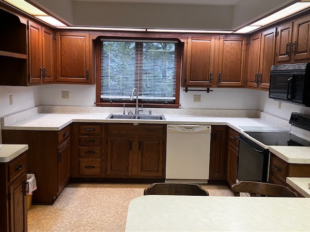 4015 East 1st Road Mendota, IL 61342 - Photo 4 of 45 a kitchen with a sink a stove and cabinets