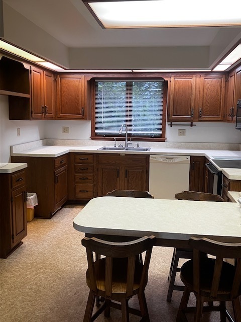 4015 East 1st Road Mendota, IL 61342 - Photo 5 of 45 a kitchen with a table chairs sink and cabinets