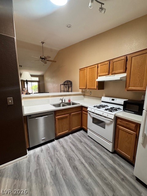 117 Tapatio Street Henderson, NV 89074 - Photo 3 of 14 This functional kitchen features ample cabinetry and modern appliances, creating a practical space for everyday living.