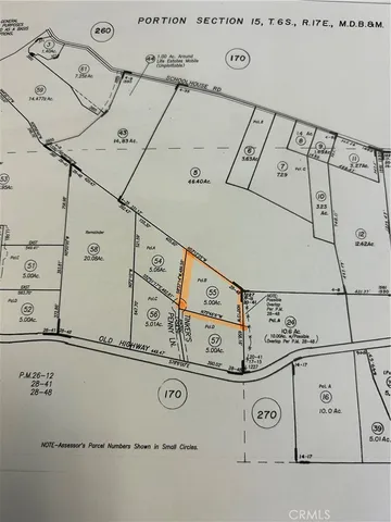 a utility room with dryer and white walls