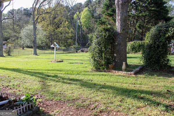 a view of a playground with basketball court