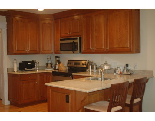 29 July Road Sudbury, MA 01776 - Photo 2 of 9 a kitchen with stainless steel appliances granite countertop a sink dishwasher and cabinets with wooden floor