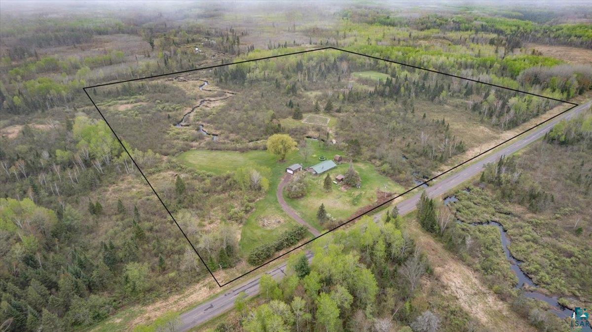 5190 County Road M Gordon, WI 54838 - Photo 29 of 31 Expansive land parcel featuring diverse tree coverage, a winding creek, and a long driveway