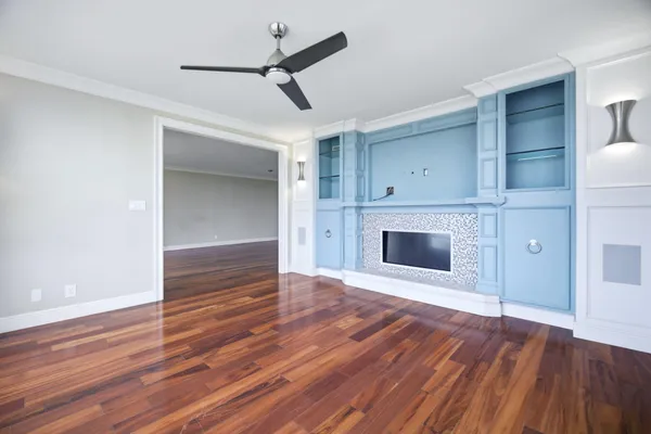 wooden floor fireplace and natural light in a room