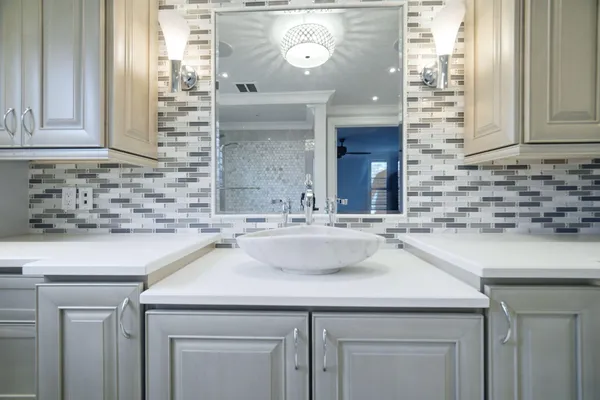 a bathroom with a sink and a mirror