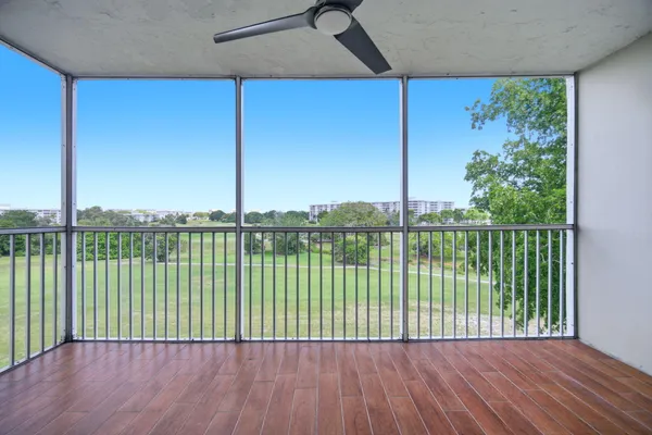 a view of a chairs on the roof deck