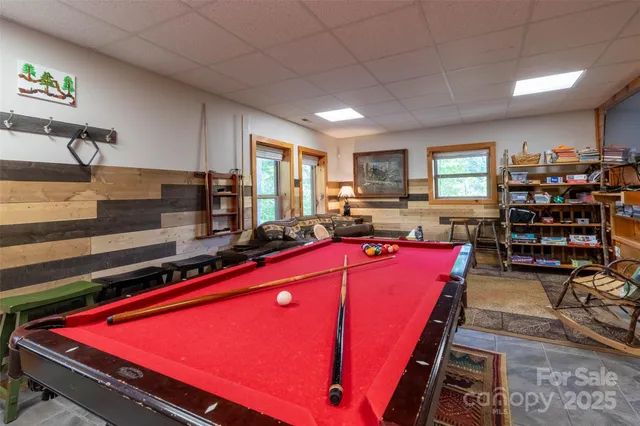 a kitchen with stainless steel appliances kitchen island granite countertop a refrigerator and a stove