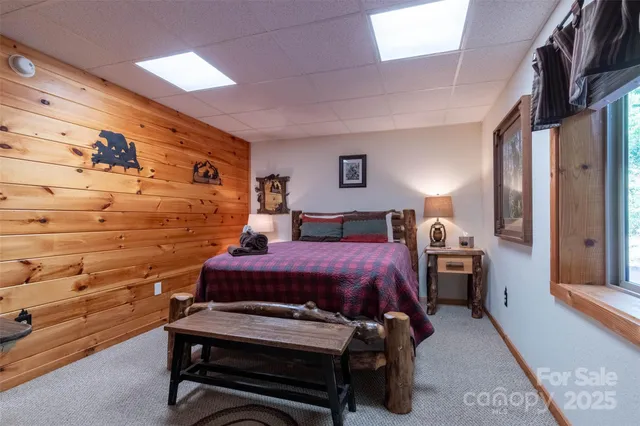 a bed room with a bed and a chair