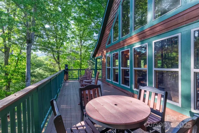 a view of a balcony with table and chairs