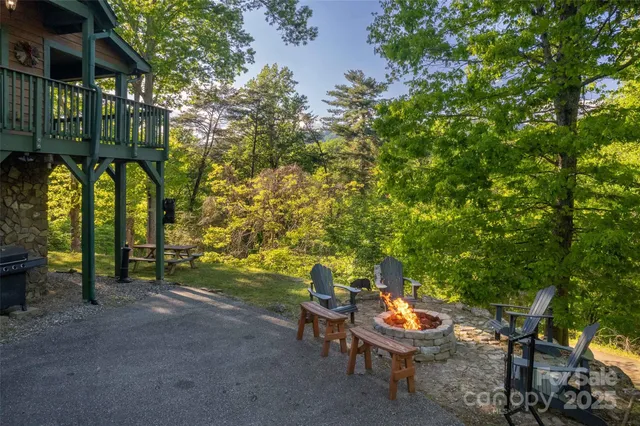 a backyard of a house with table and chairs