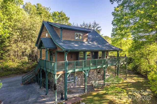 a view of a house with a tree