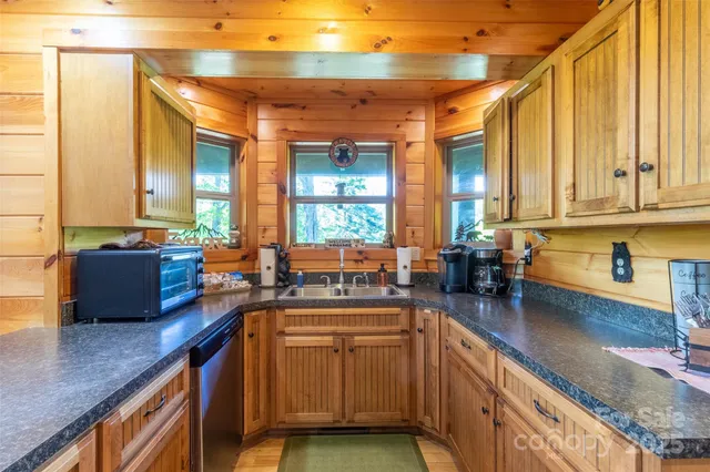 a kitchen with lots of counter top space and living room