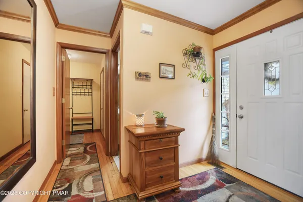 view of hall way with mirror and furniture