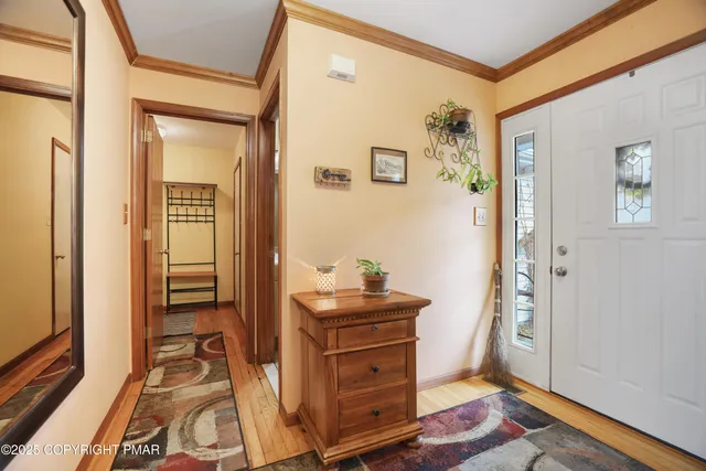 view of hall way with mirror and furniture