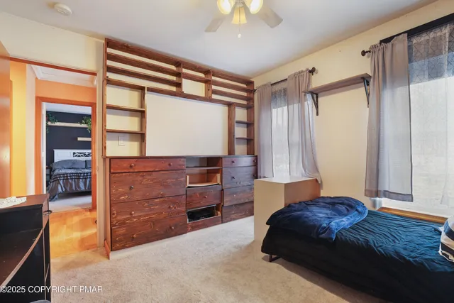 a bedroom with a bed and a dresser