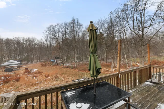 a view of a park with iron fence