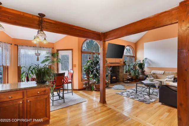 a living room filled with furniture and a flat screen tv