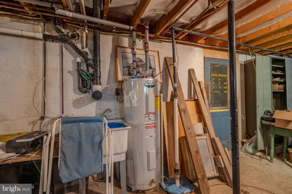a view of walk in closet with wooden floor
