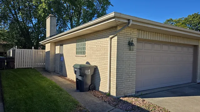a back view of a house with backyard