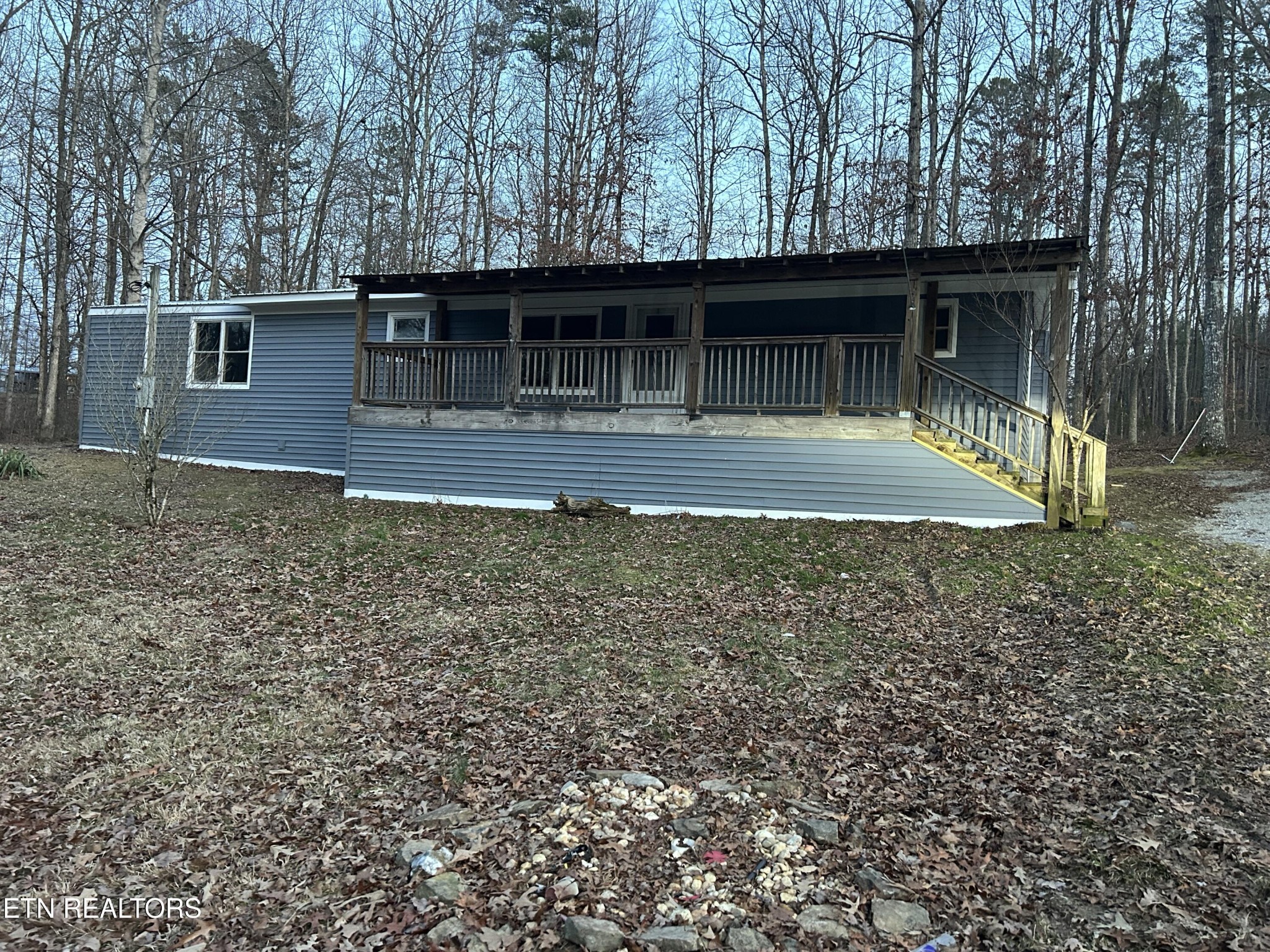994 Pioneer Road Grimsley, TN 38565 - Photo 1 of 20 a front view of a house with garden